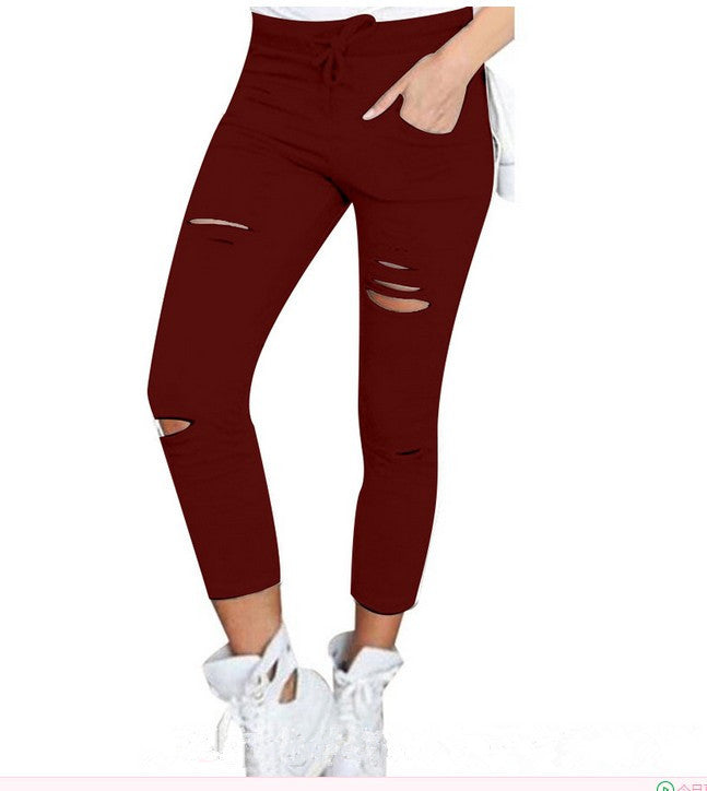 European and American women's clothing ripped casual nine-point pencil pants