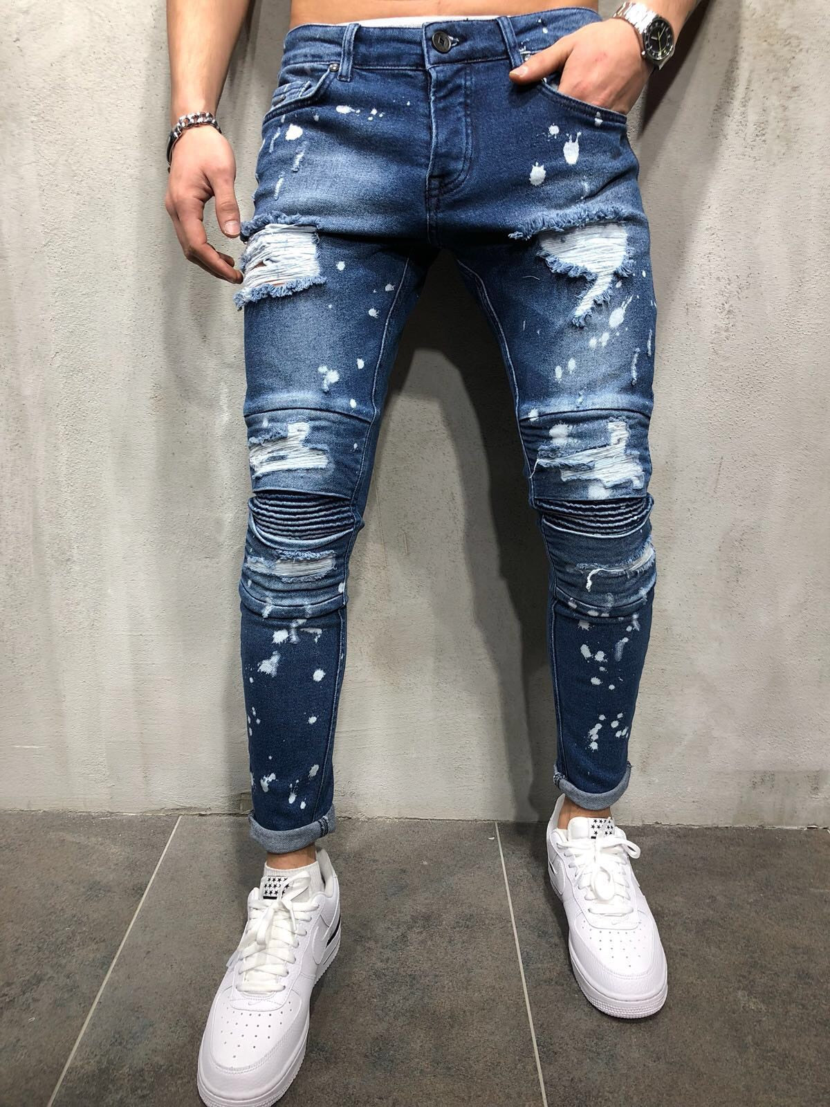 Men's European and American high street slim stretch jeans ripped spray paint white trousers pleated feet pants