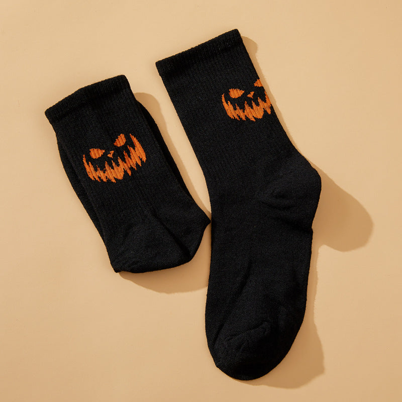 Solid color pumpkin face vertical pattern socks in Europe and the United States Halloween funny grimace personality trend socks