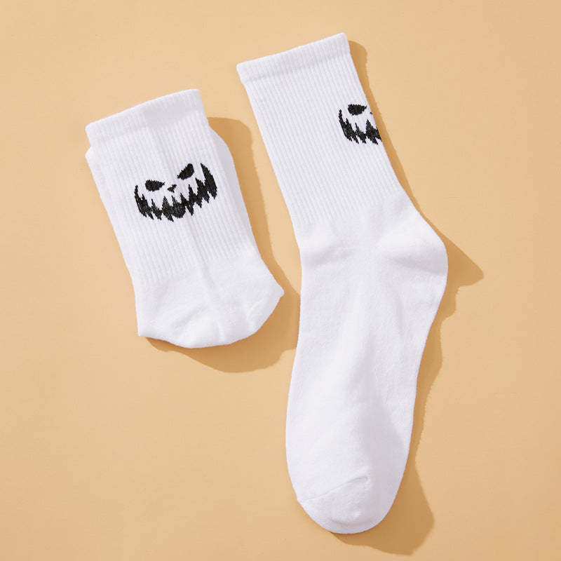 Solid color pumpkin face vertical pattern socks in Europe and the United States Halloween funny grimace personality trend socks