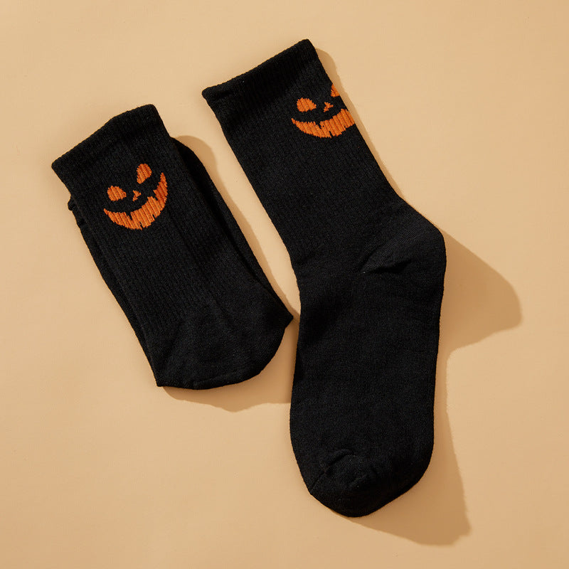 Solid color pumpkin face vertical pattern socks in Europe and the United States Halloween funny grimace personality trend socks