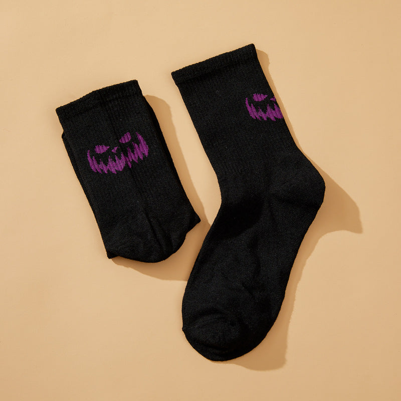 Solid color pumpkin face vertical pattern socks in Europe and the United States Halloween funny grimace personality trend socks