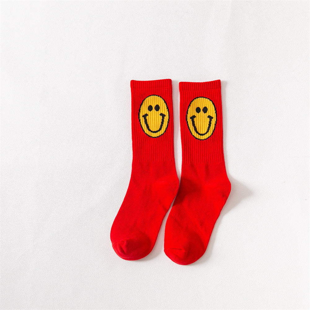 New products Japanese solid color smiley classic basic ladies cotton mid-length tube socks