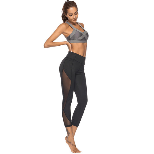 Women's solid color hollow hip-lifting yoga pants sports mesh stitching leggings